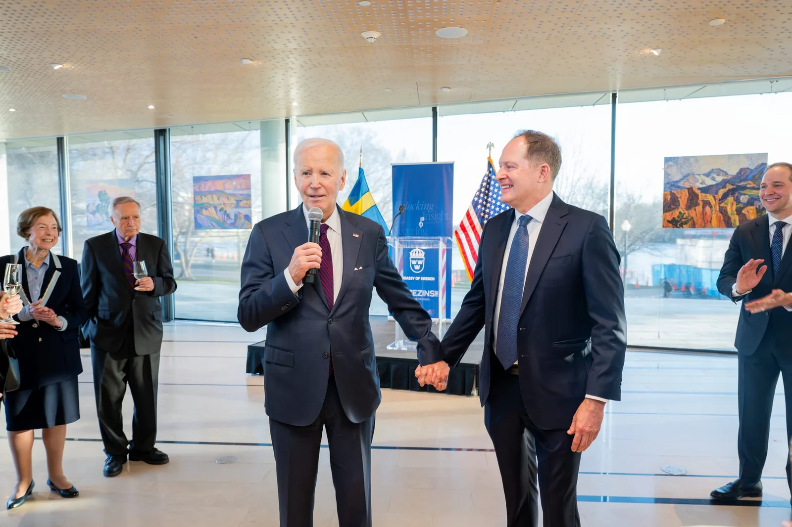Former President Joe Biden with guests at the reception
